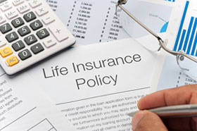 person signing life insurance policy